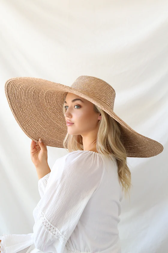 Designed for ultimate sun protection with an uncompromising aesthetic, it brings a touch of cinematic glamour to any poolside or beachside setting.