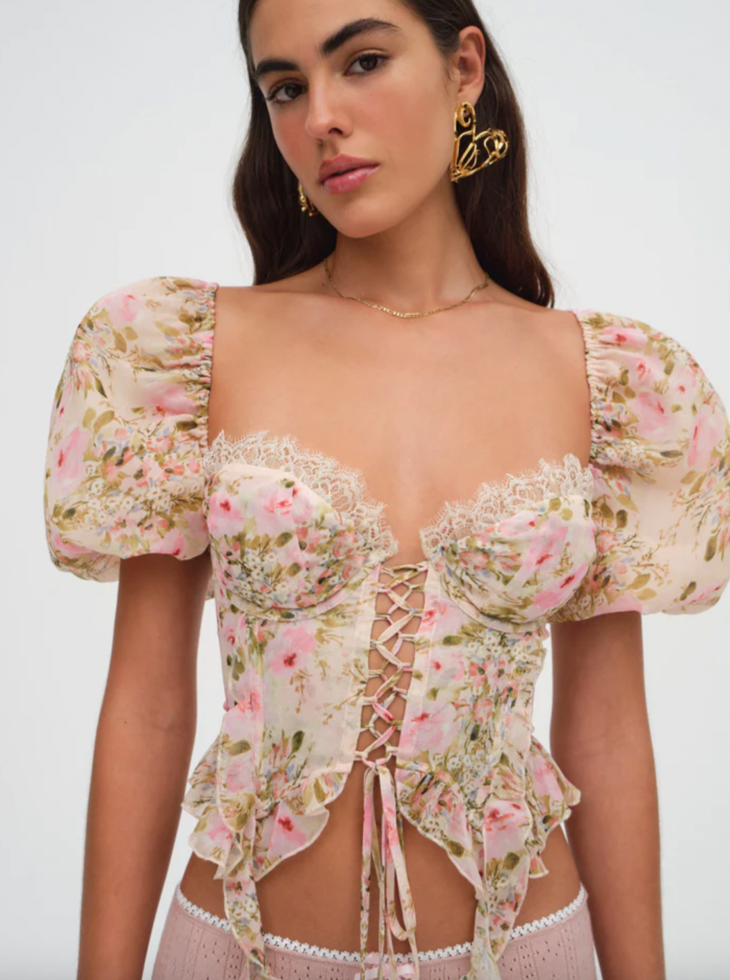 Floral lace-up corset crop top with puff sleeves and delicate lace details, perfect for date nights, vacations, brunches, and summer styling.