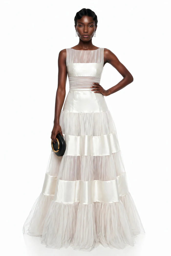 Ivory mesh satin maxi dress. Featuring sheer layered details and a flowing silhouette perfect for weddings and formal events.