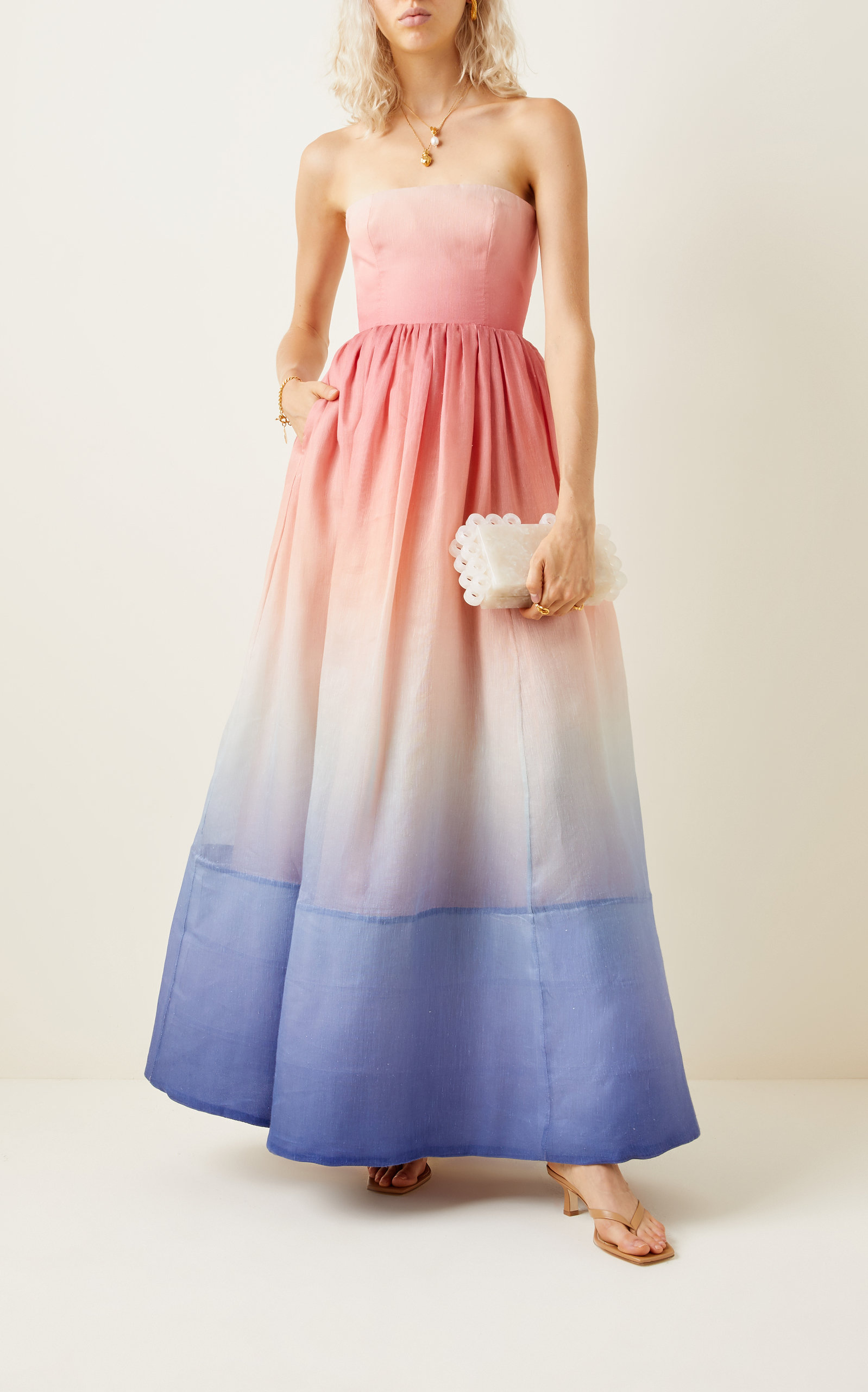 Sunset Ombre Strapless Maxi Dress. Featuring a dreamy pink-to-blue gradient, strapless neckline—perfect for vacations, weddings, and elegant summer styling.