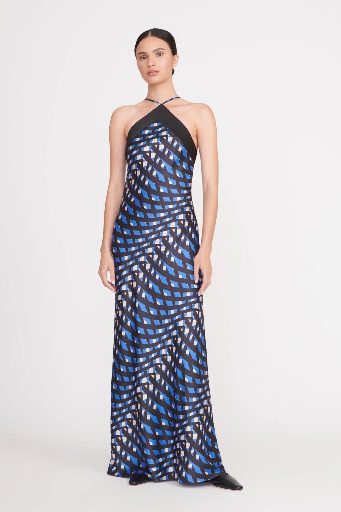 Grid Halter Maxi Dress. Featuring a striking optical illusion print, and a sleek column silhouette—perfect for upscale resort dinners and formal evening events.