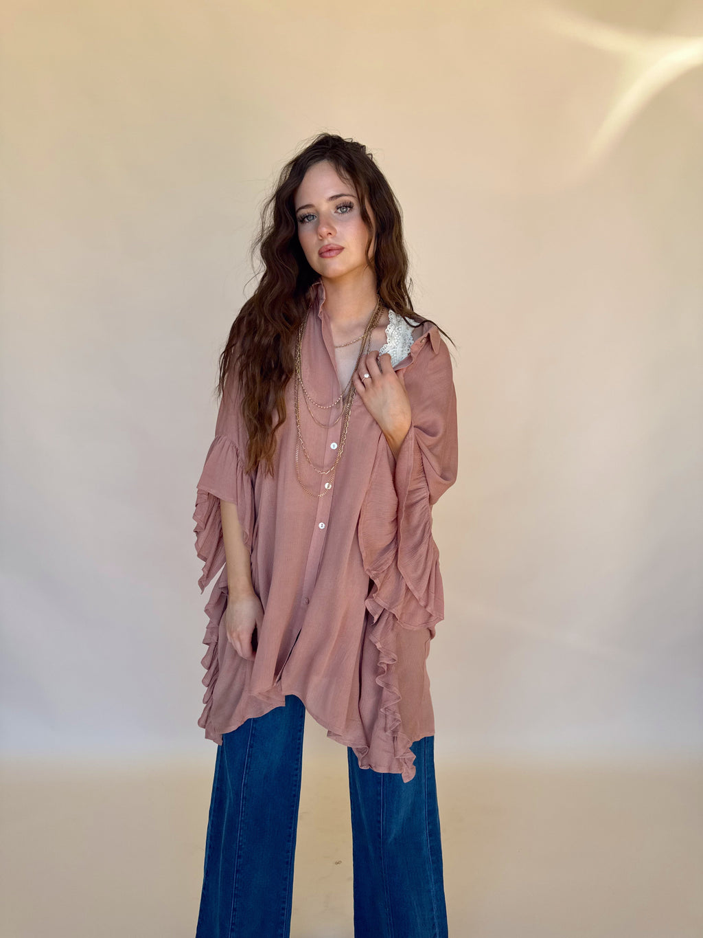Oversized Ruffle Sleeve Blouse. Featuring a breezy sheer fabric,and dramatic cascading ruffled sleeves—perfect for beach days, festival styling