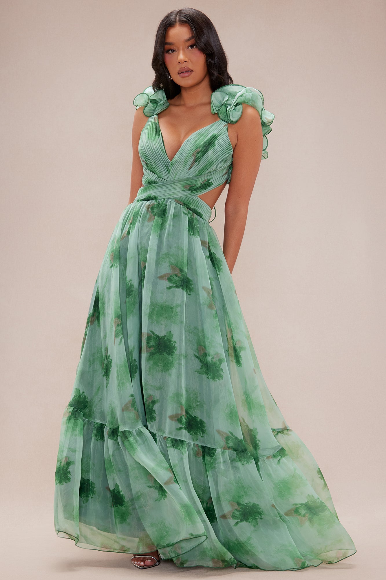 Floral Ruffle Cutout Maxi Dress. Pleated criss-cross bodice, side cutouts, and dramatic ruffle shoulders—perfect for summer galas and formal garden weddings.