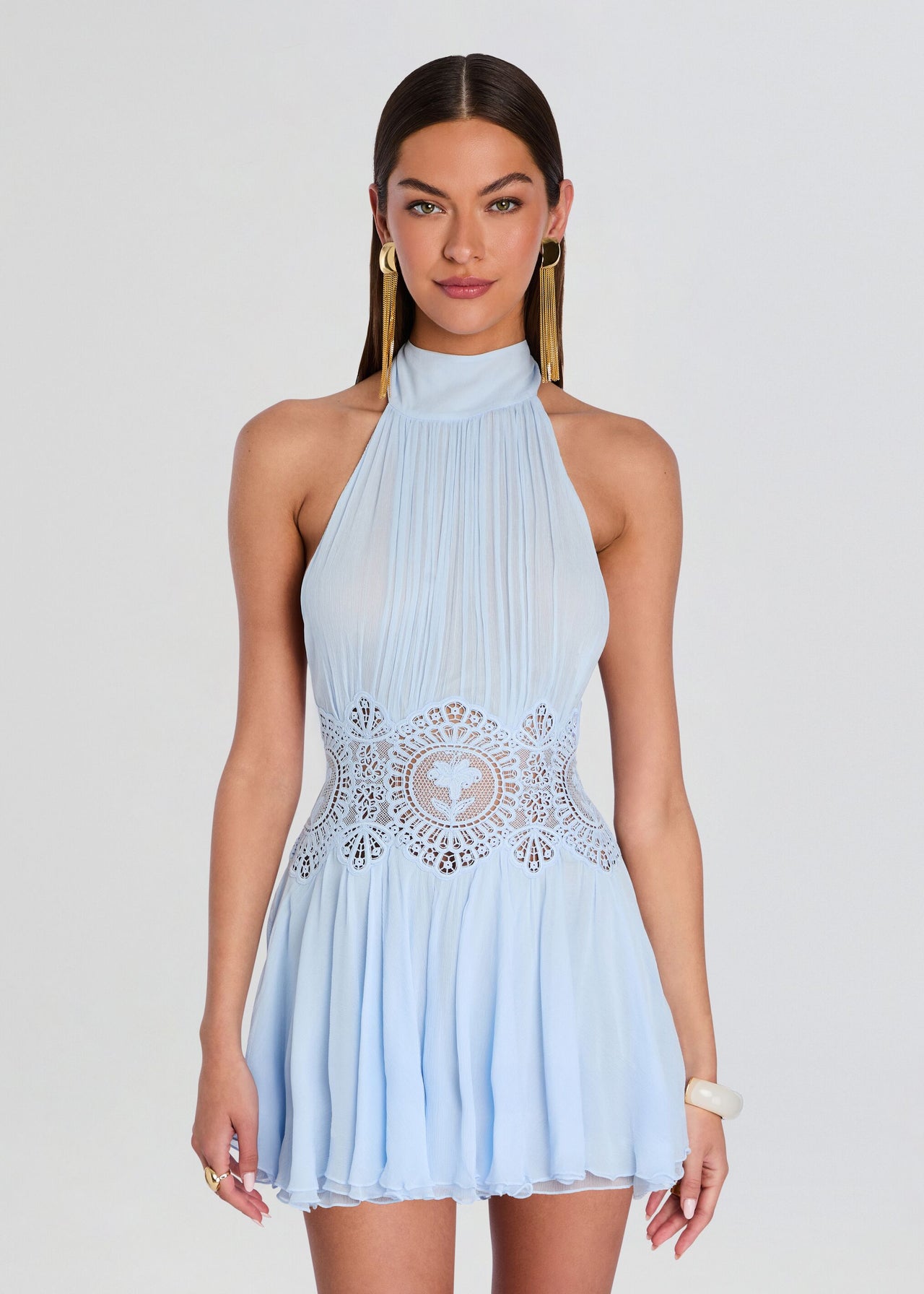 Blue Chiffon Halter Mini Dress. Intricate floral lace waist detailing, and a chic halter silhouette—perfect for upscale cocktail events and luxury resort parties.