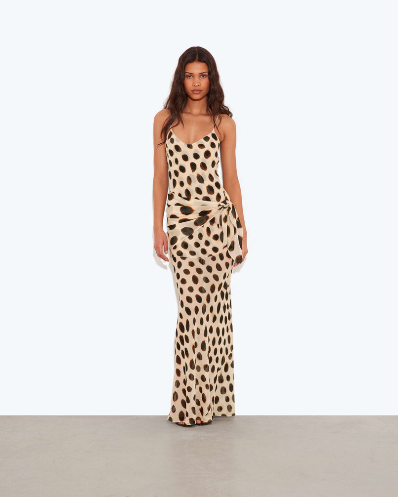 Spot Tie-Waist Slip Maxi Dress. Chic sarong-style hip tie, and a bold oversized animal print—perfect for island nights and glamorous sunset dinners.