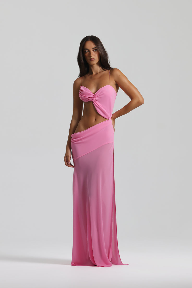 Cutout Maxi Dress.Daring waist cutouts, and a flowing sheer-overlay skirt, this ethereal piece is perfect for your next luxury coastal getaway.