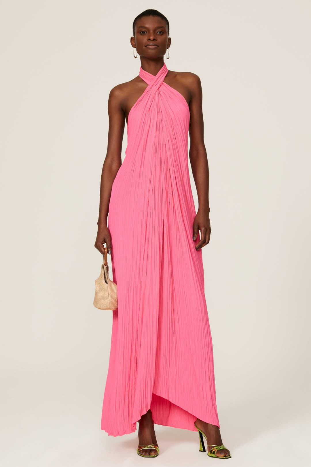 Pleated Halter Maxi Dress. Elegant crossover halter neckline, and a flowing floor-length silhouette—the ultimate statement piece for your next resort occasion.