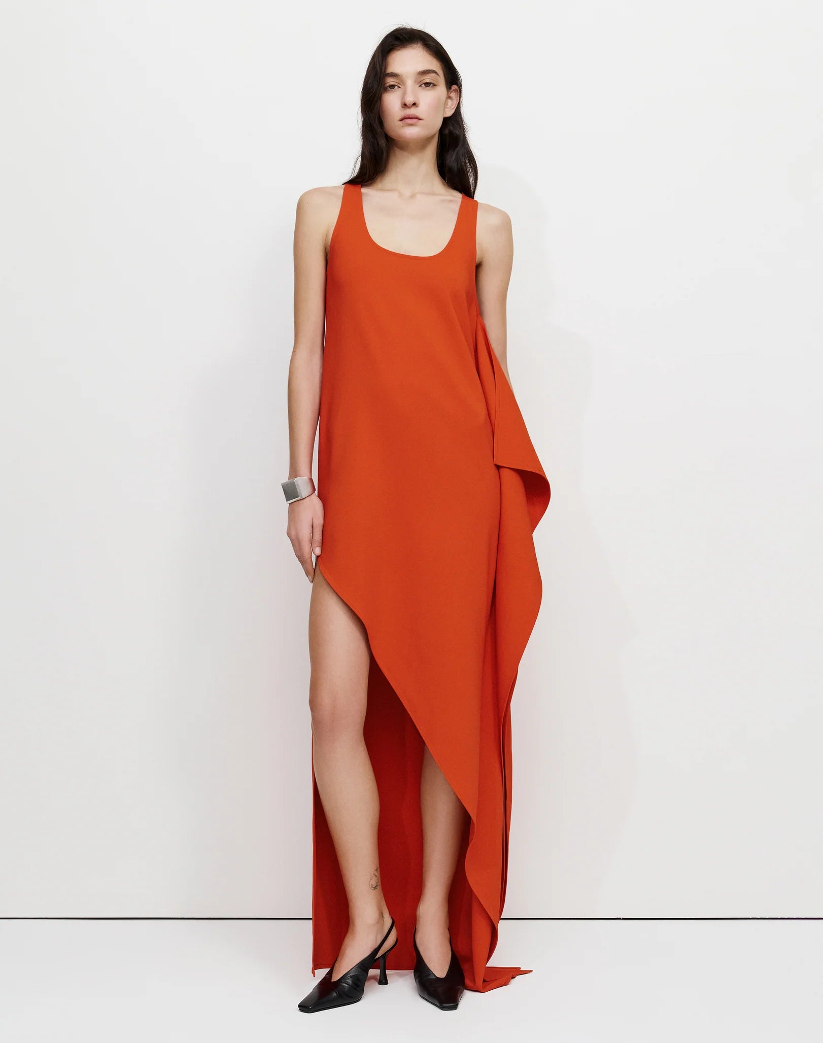 Draped Maxi Dress. Featuring a bold, architectural side drape, a striking high-cut slit—the perfect sophisticated choice for your next upscale resort evening.