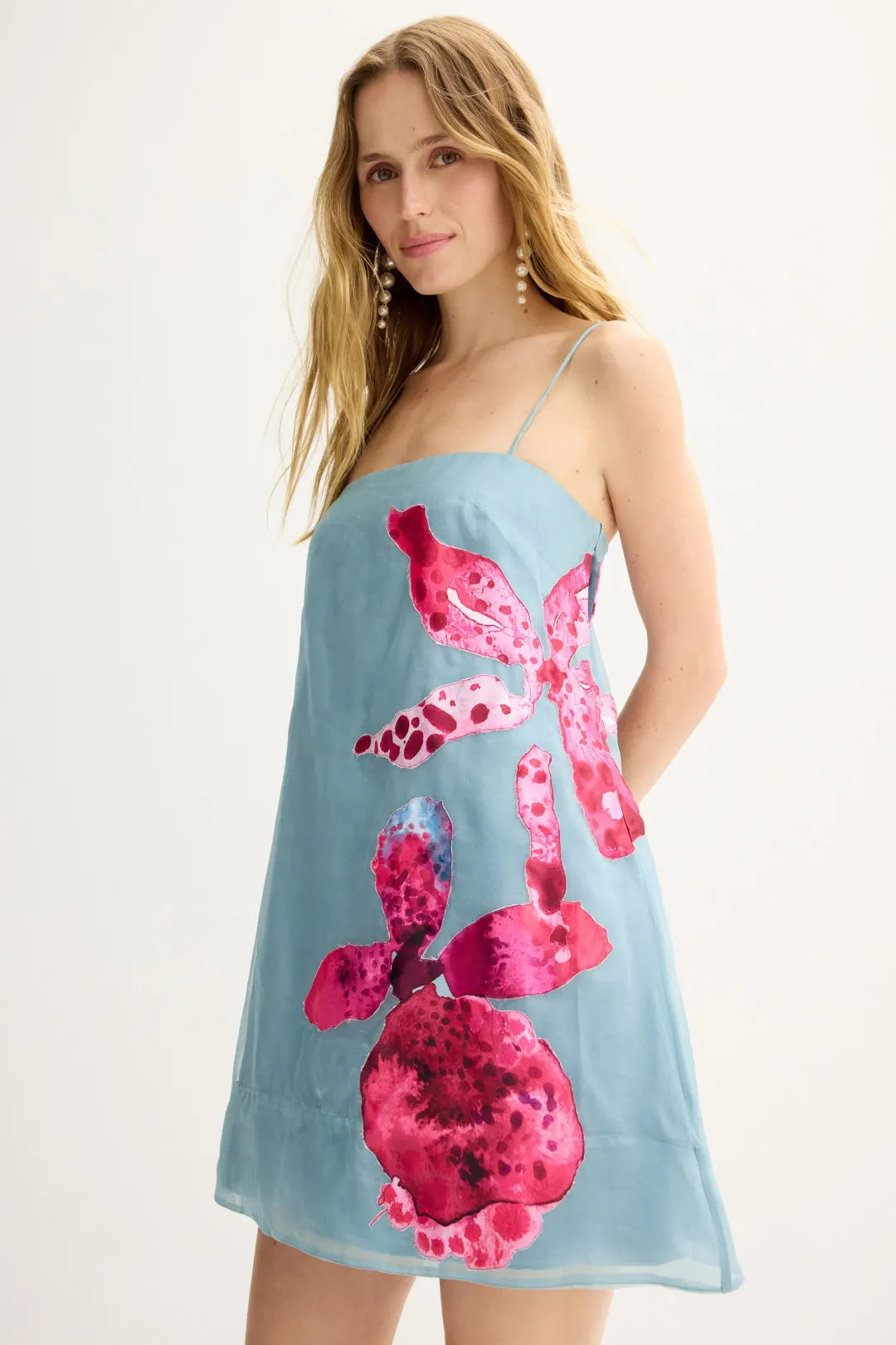 Floral  Mini Dress. Artistic pink floral appliqué detailing, and a classic strapless mini silhouette—perfect for effortless resort style.