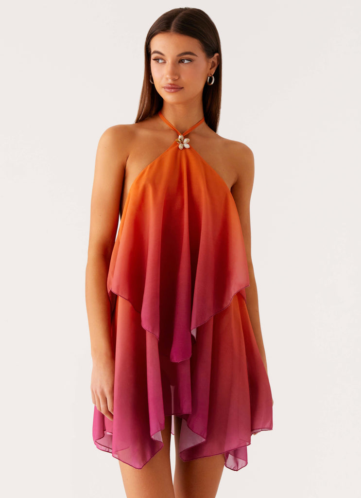 Sunset Gradient Halter Mini Dress. Featuring a vibrant orange-to-fuchsia gradient, elegant halter neckline with a delicate floral clasp.