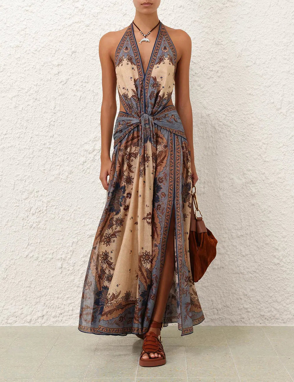 Bohemian Maxi Dress. This floor-length piece combines intricate paisley with a flattering, knotted halter silhouette, perfect for sophisticated summer escapes.