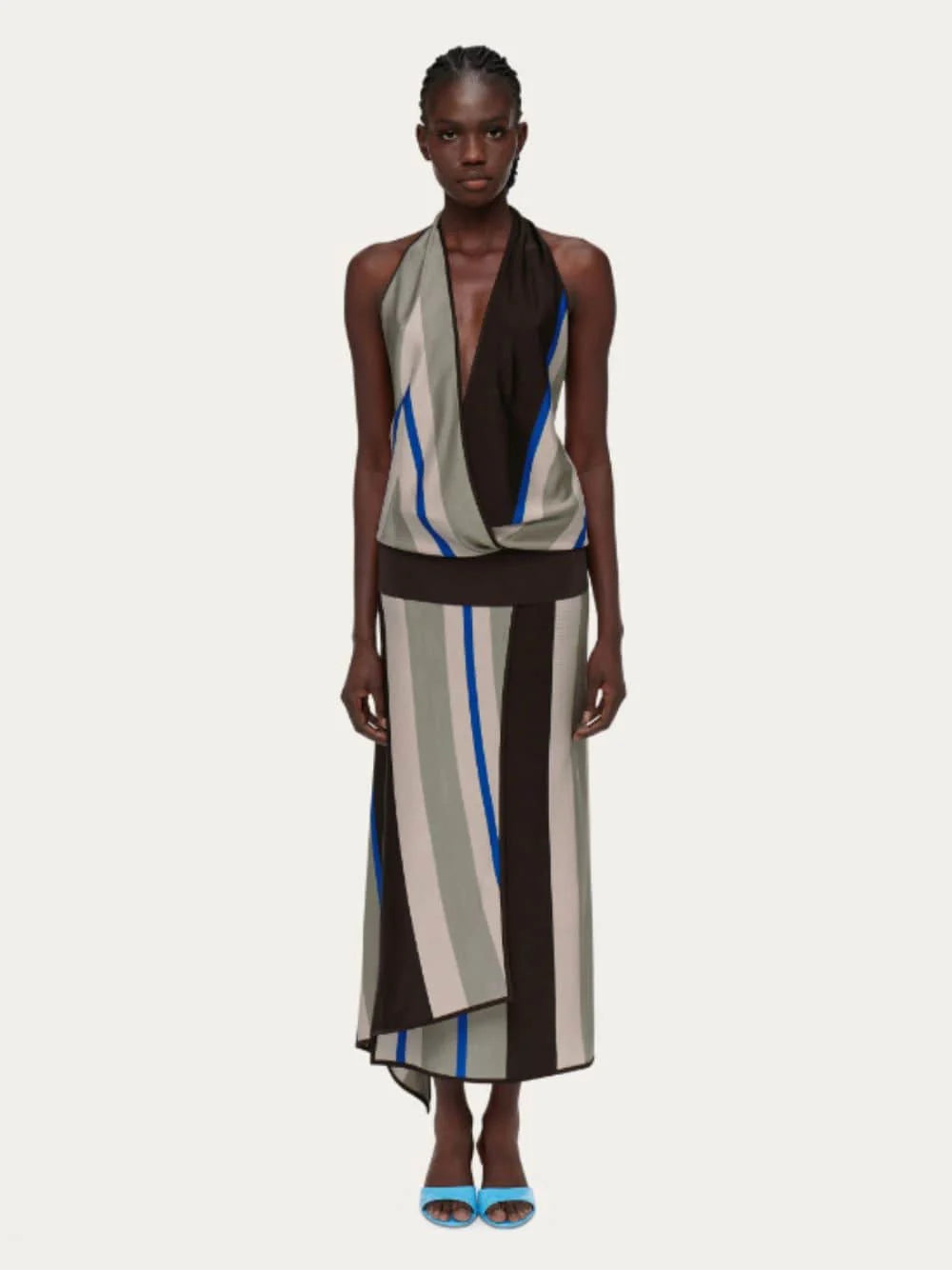 Striped Halter Maxi Dress. Featuring a bold, multi-tonal stripe motif, deep-V halter neckline, modern silhouette perfect for upscale evening soirées.