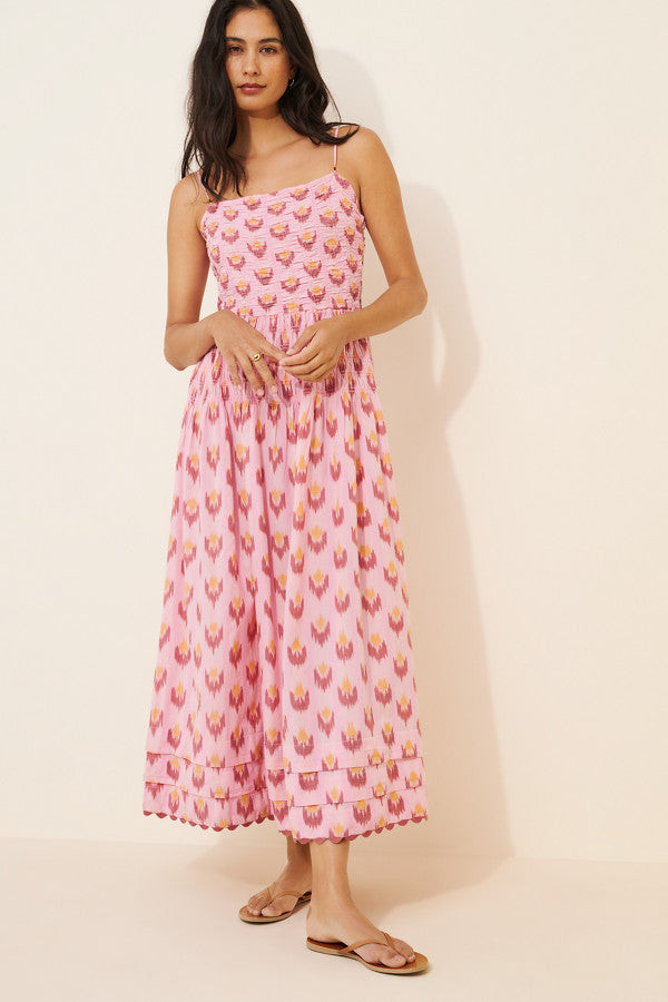 Smocked Midi Dress. Featuring a comfortable smocked bodice,this dress is the perfect blend of playful style and effortless comfort for your next getaway.