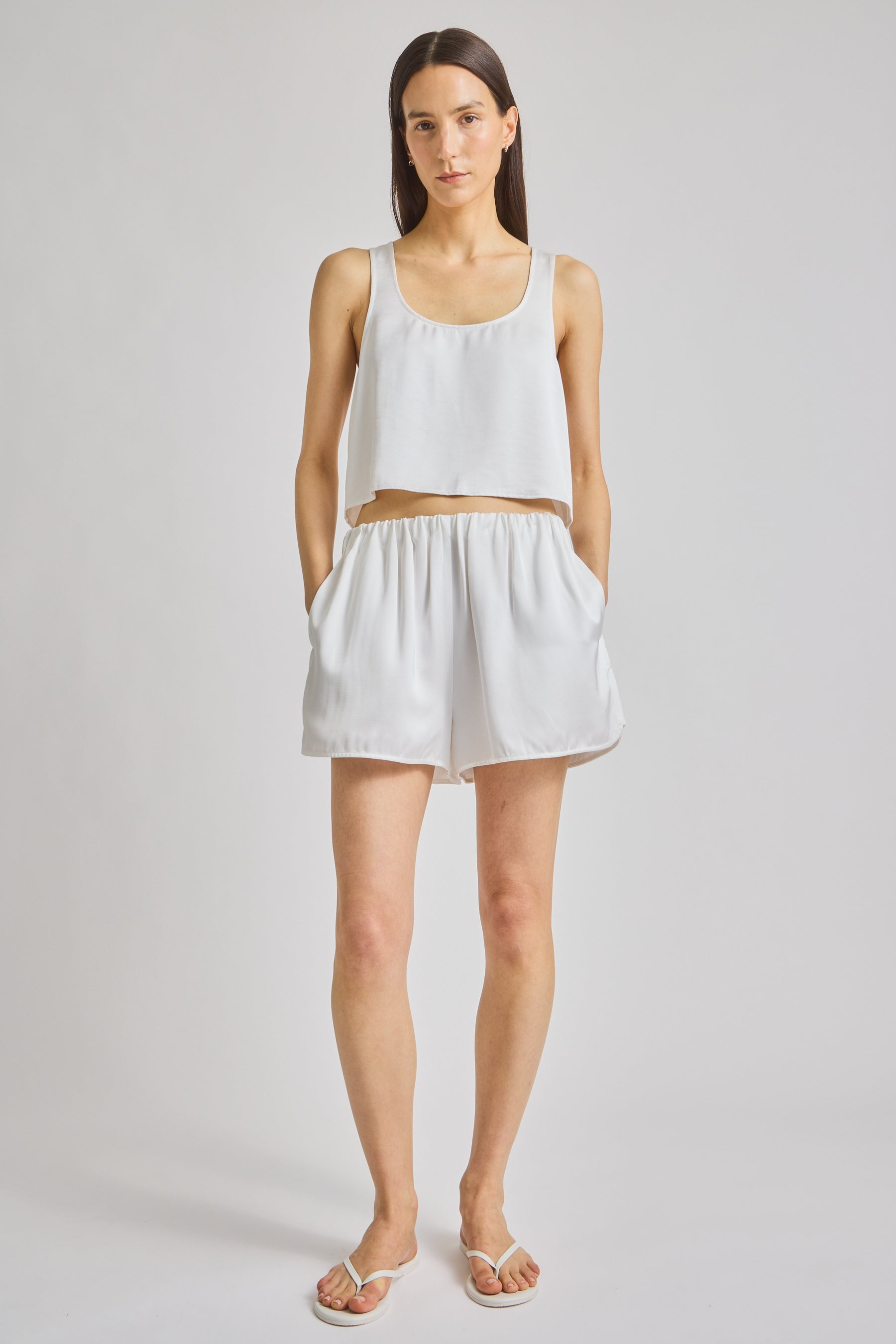 Minimalist White Lounge Co-ord Set. Featuring a clean-cut sleeveless top and comfortable shorts, perfect for effortless relaxation and chic summer lounging.
