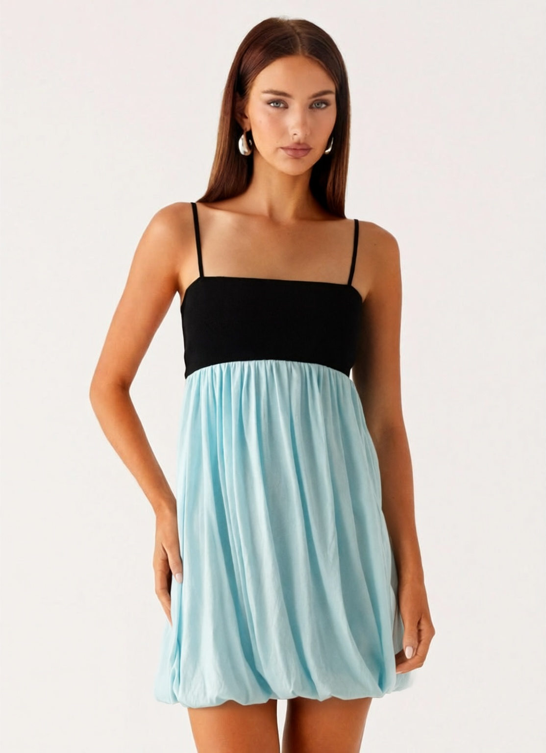 Block Bubble Mini Dress. Featuring a chic contrast black bodice, a voluminous light blue bubble skirt, and a modern silhouette perfect for your summer getaways.