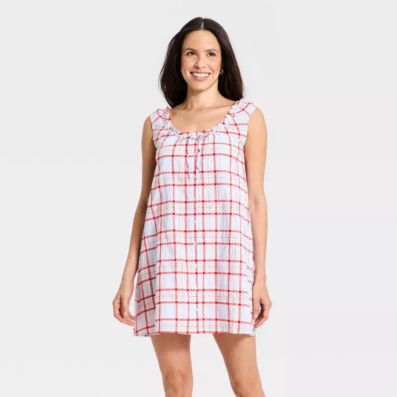 Plaid Ruffle-Neck Mini Dress. Delicate ruffle-neck detail, and a relaxed button-down silhouette, this mini is the perfect choice for effortless summer relaxation.