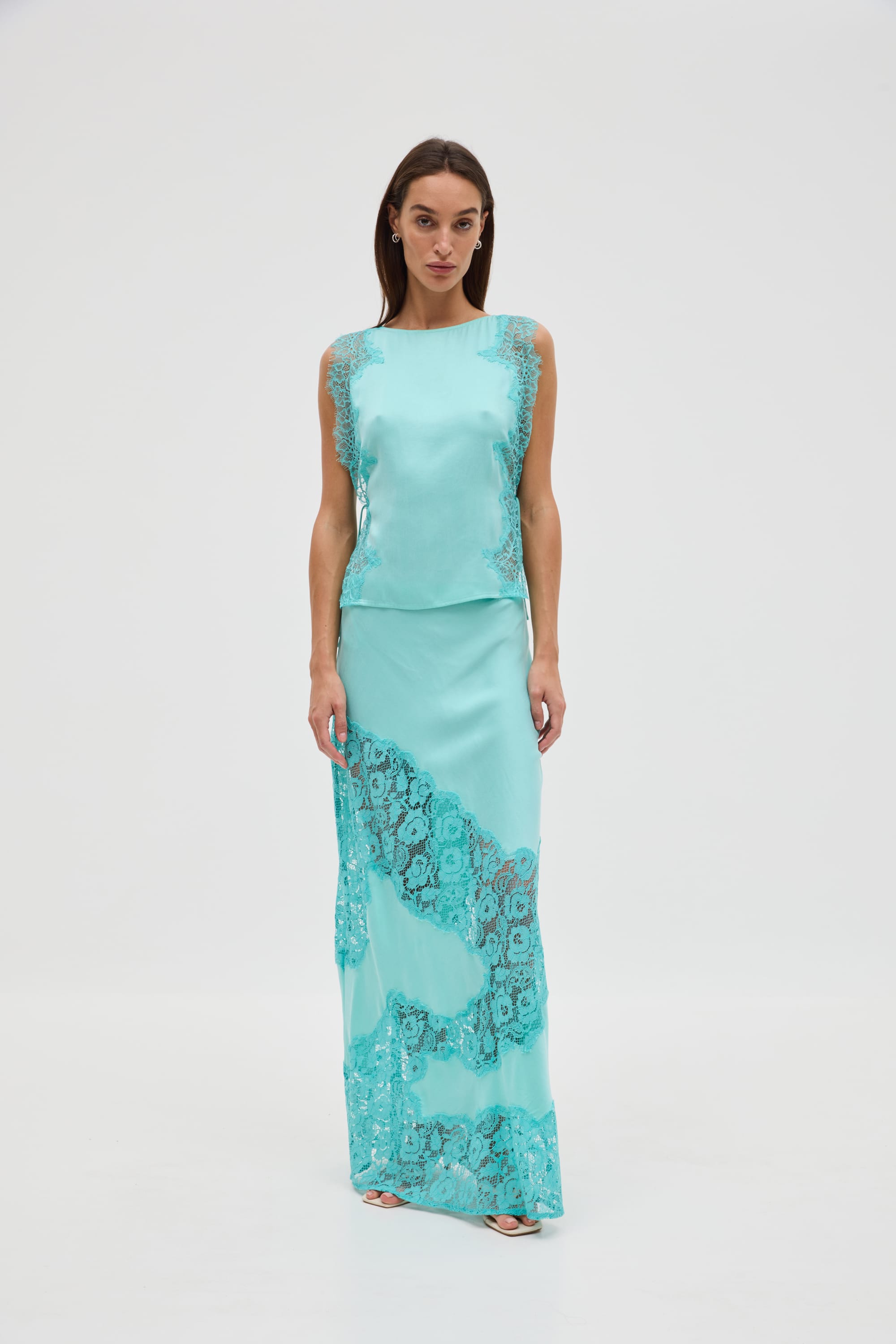 Lace-Trimmed Satin Set. Featuring intricate lace detailing and a fluid, satin-feel silhouette, this matching set is perfect for sophisticated summer soirées.