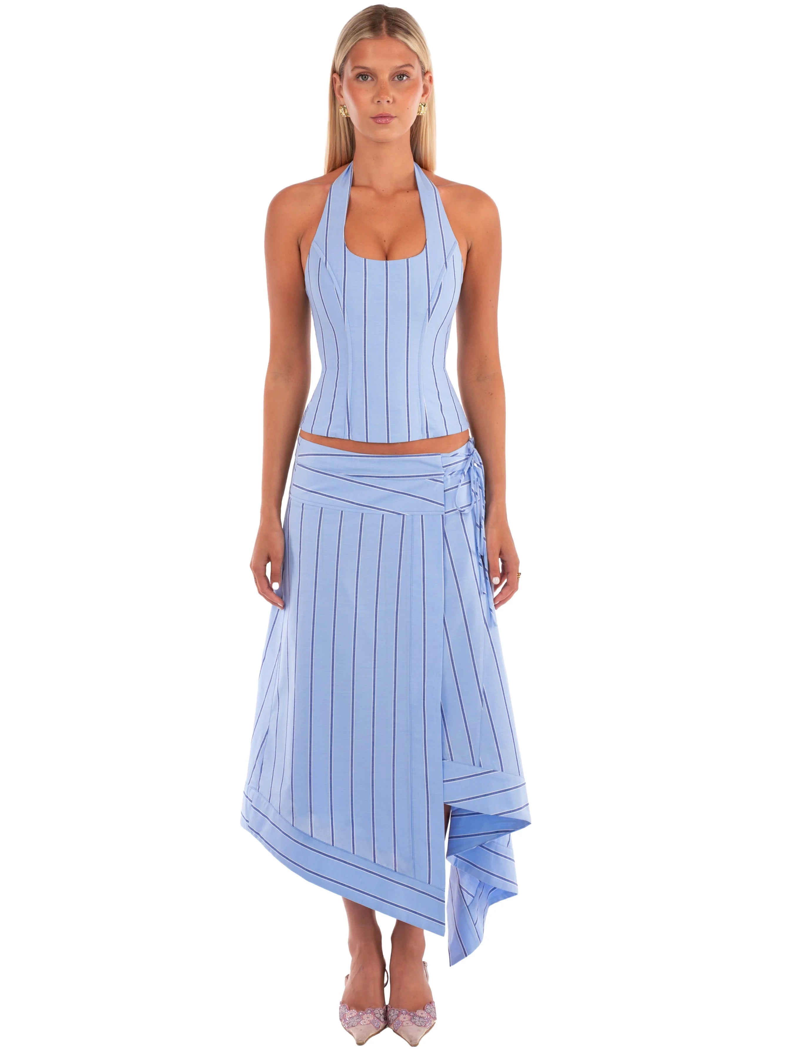 Stripe Halter Co-ord Set. Featuring a structured halter top and a chic asymmetric wrap skirt, this matching set is the ultimate choice for sophisticated resort wear.
