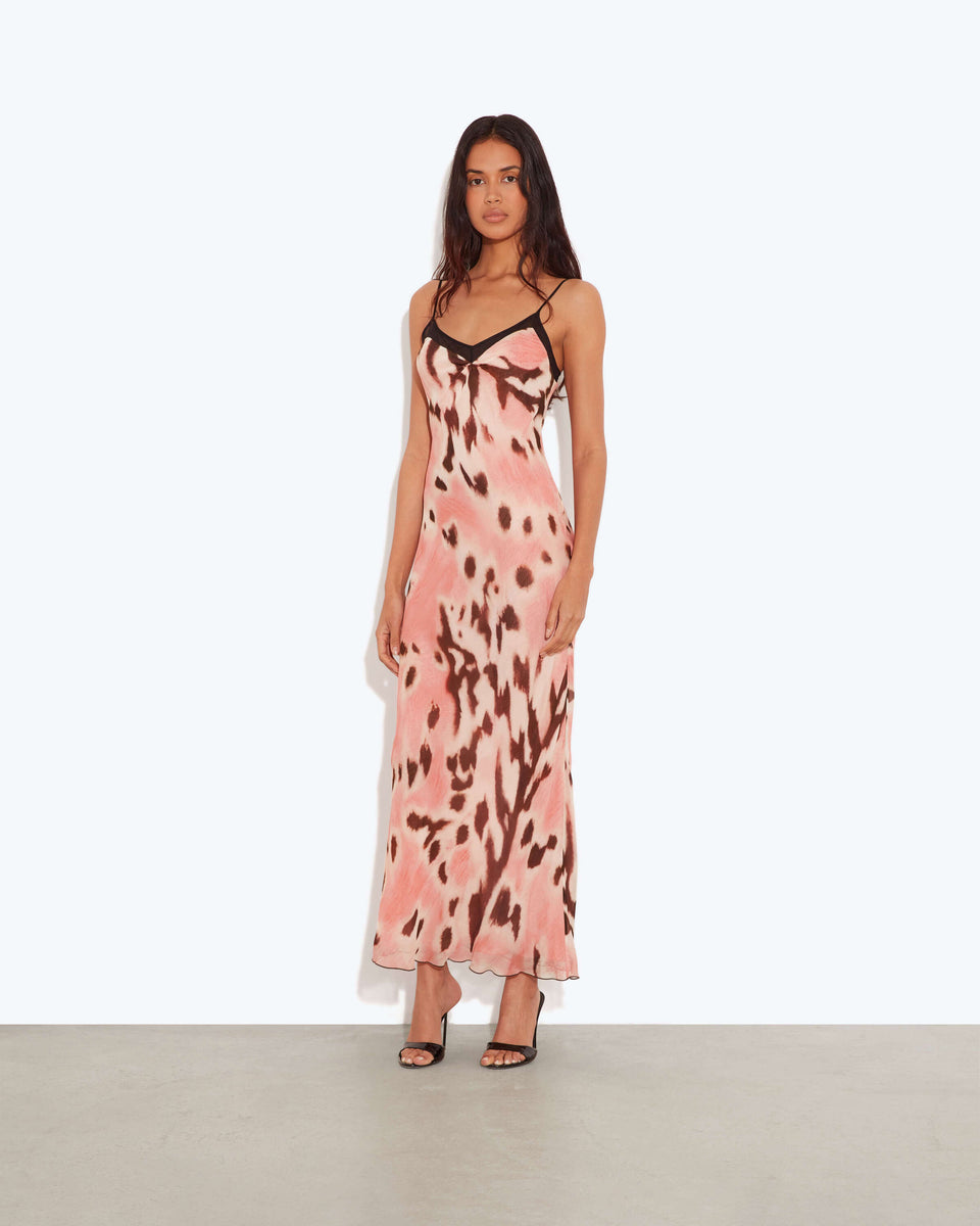 Abstract Print Slip Maxi Dress.Graphic print,and a sultry silhouette, this piece is the ultimate statement choice for your next sun-drenched getaway.