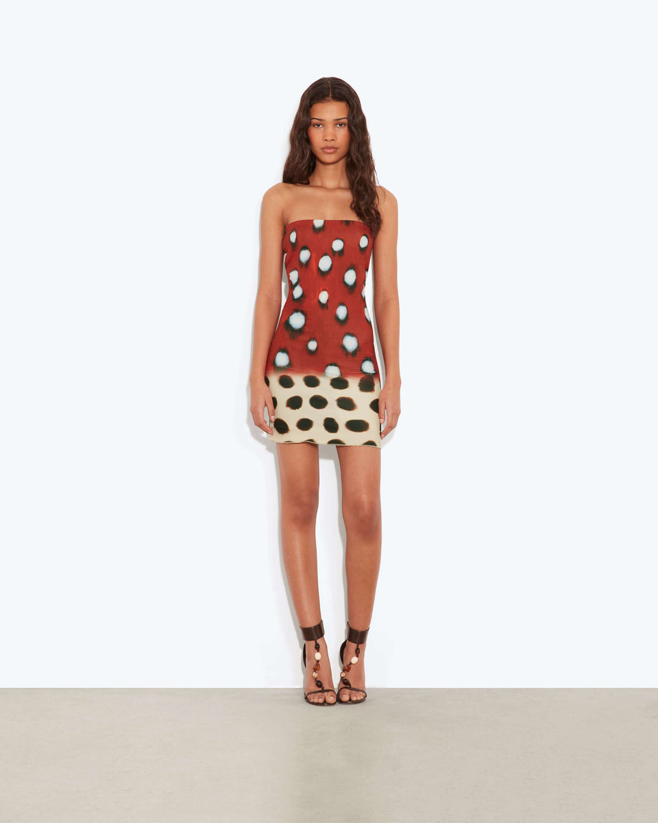 Polka-Dot Bandeau Mini Dress. Featuring an eye-catching two-tone design, abstract spot print, and a sleek bandeau necklineIt is the perfect choice for you.