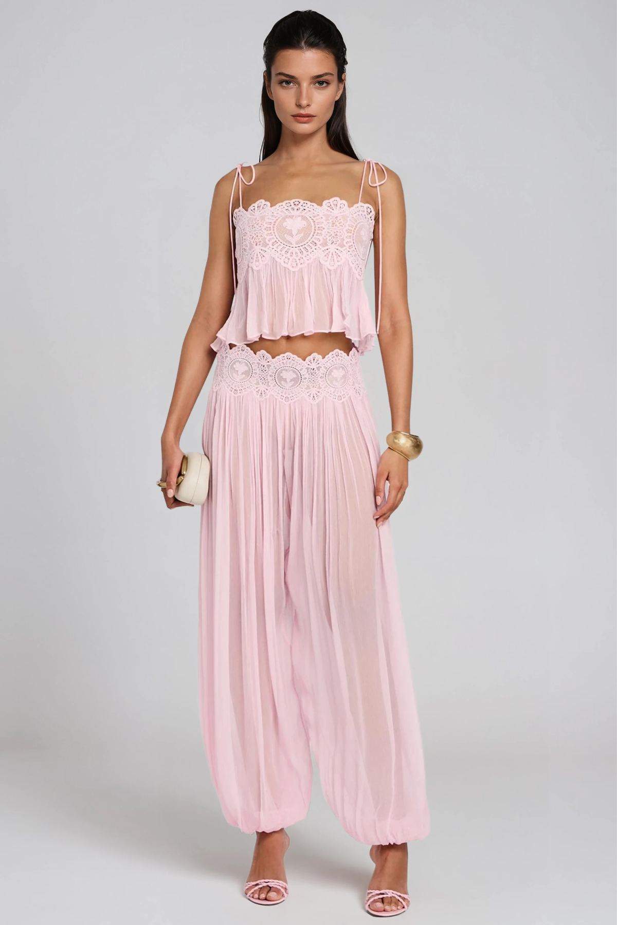 Ethereal Blush Lace Set. Lace detailing, a soft powder-pink hue, and a breezy silhouette,is the ultimate statement choice for your next sun-drenched getaway.