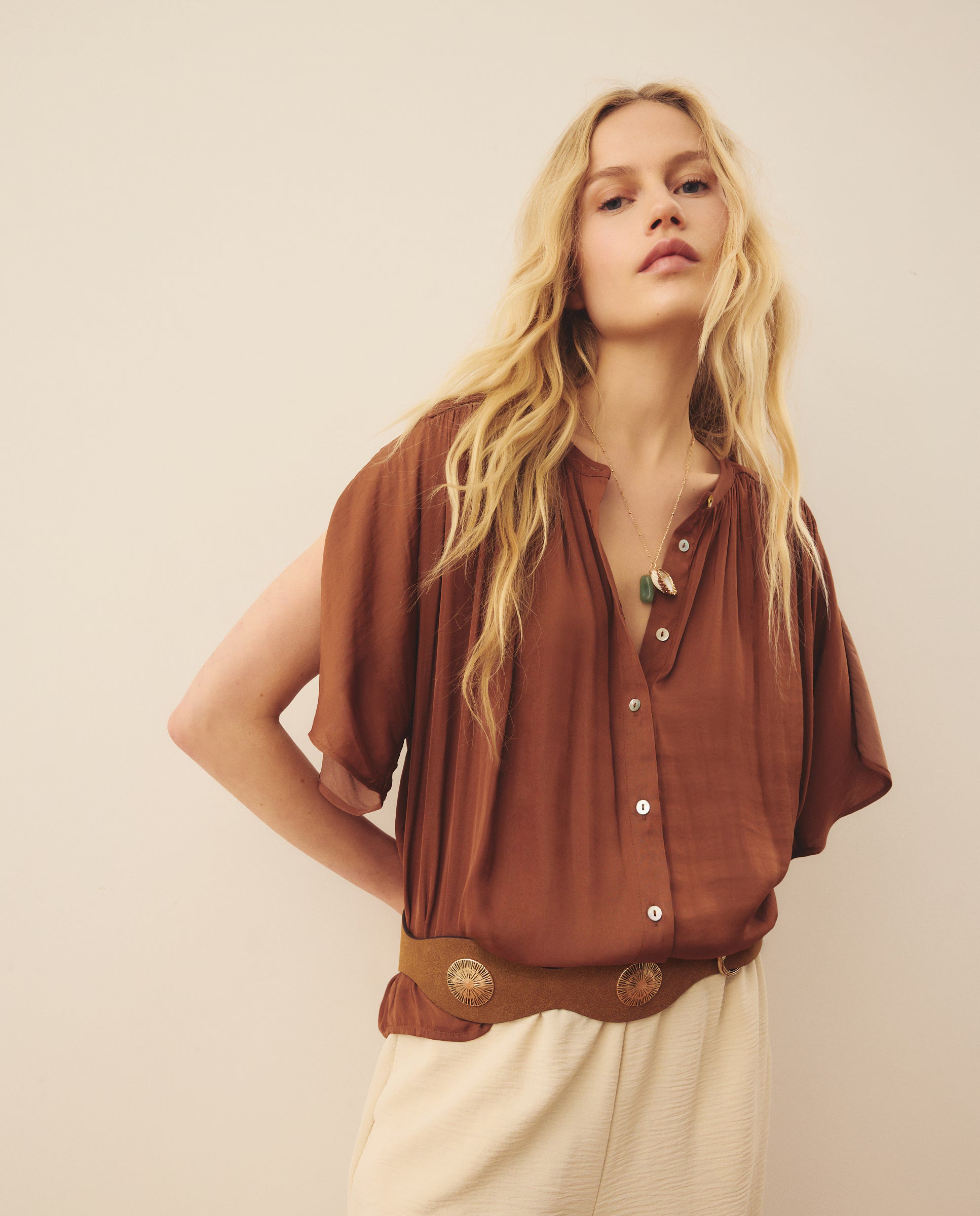 Ethereal Silk-Touch Blouse. Delicate button-front detailing, and a breezy,this piece is the ultimate choice for effortless, sun-drenched elegance.
