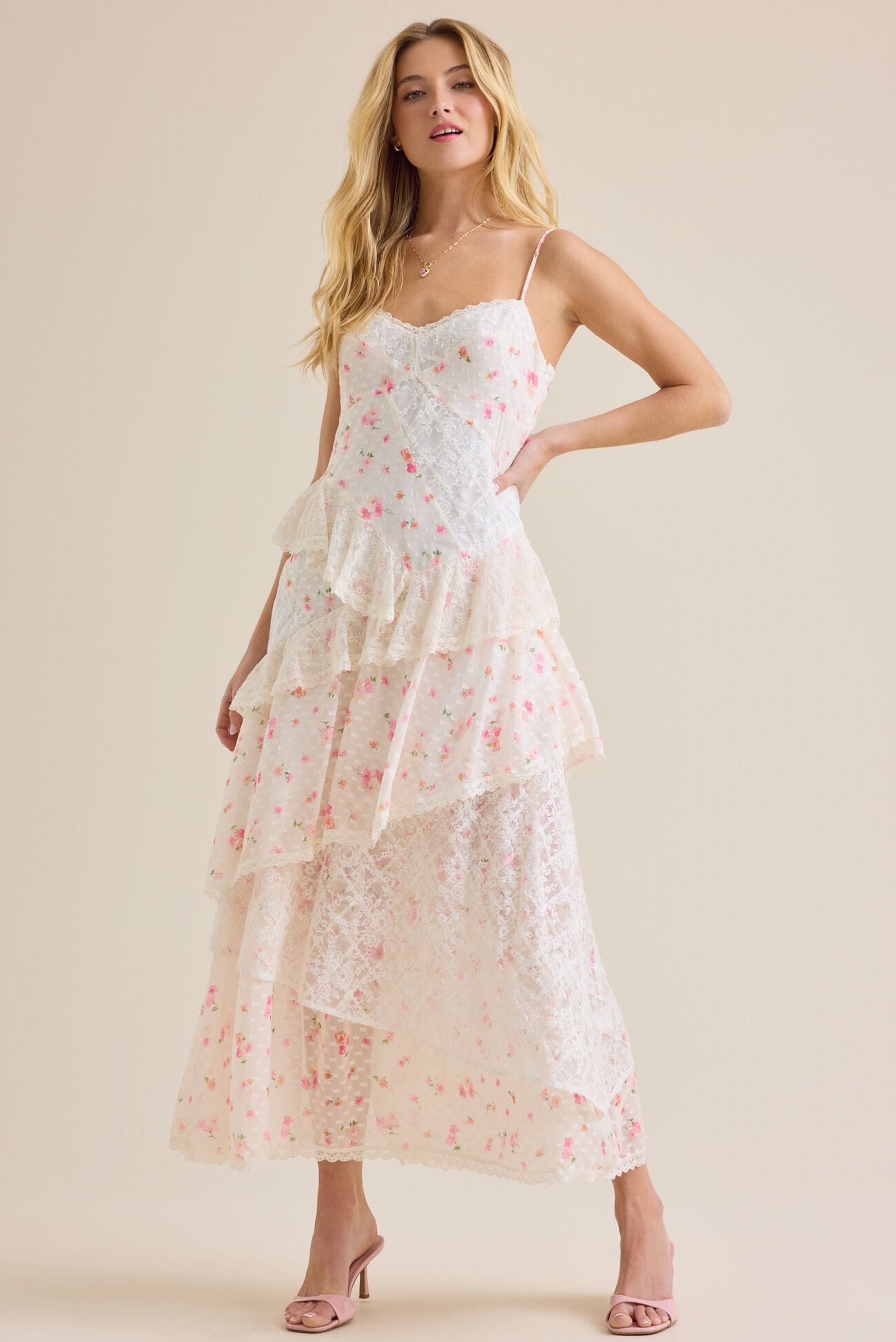 Sheer dotted mesh, cascading lace-trimmed tiers, and a romantic slip silhouette, this gown is the ultimate choice for elevated summer soirées and romantic getaways.