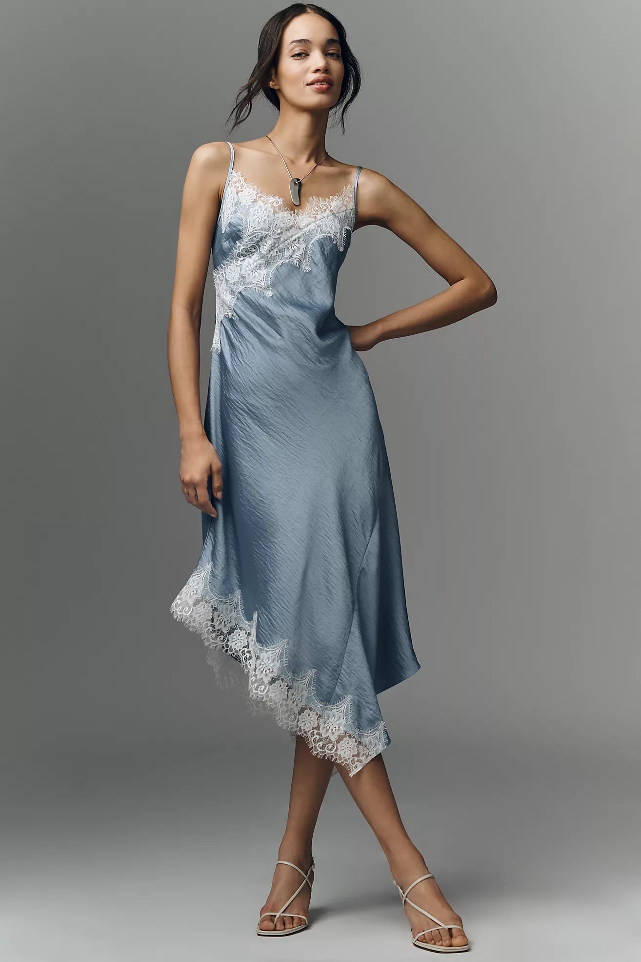 Featuring a intricate white lace detailing, and a flattering bias-cut silhouette, this midi dress is the ultimate choice for elevated vacation evenings.