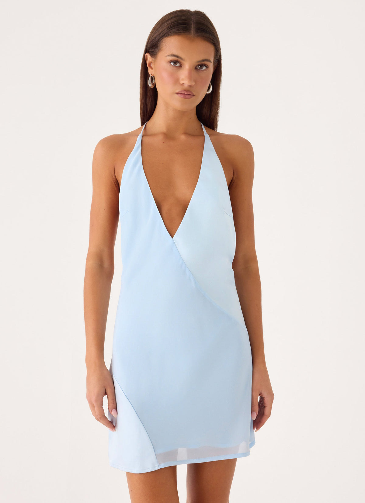 Featuring a sophisticated plunging halter neckline, a chic wrap-style silhouette,this dress is the ultimate choice for elevated beach club afternoons.