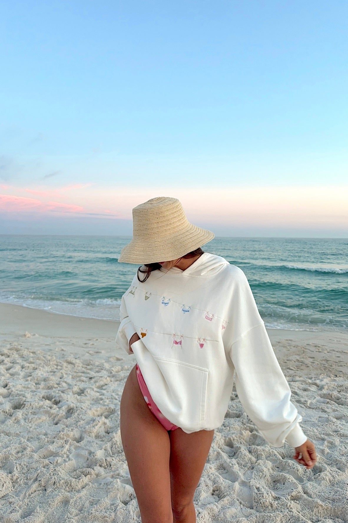 Featuring playful, hand-touched bikini motifs,breezy fit—it’s the perfect cover-up for cool seaside evenings and sun-drenched morning walks.