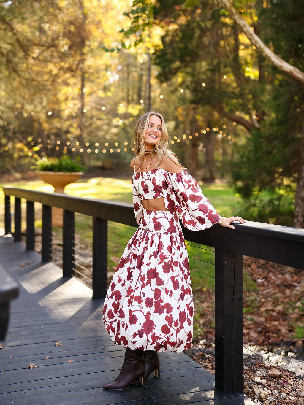 Featuring voluminous puff sleeves, an a bold crimson botanical print, this two-piece set is the ultimate statement piece for elevated summer garden parties.
