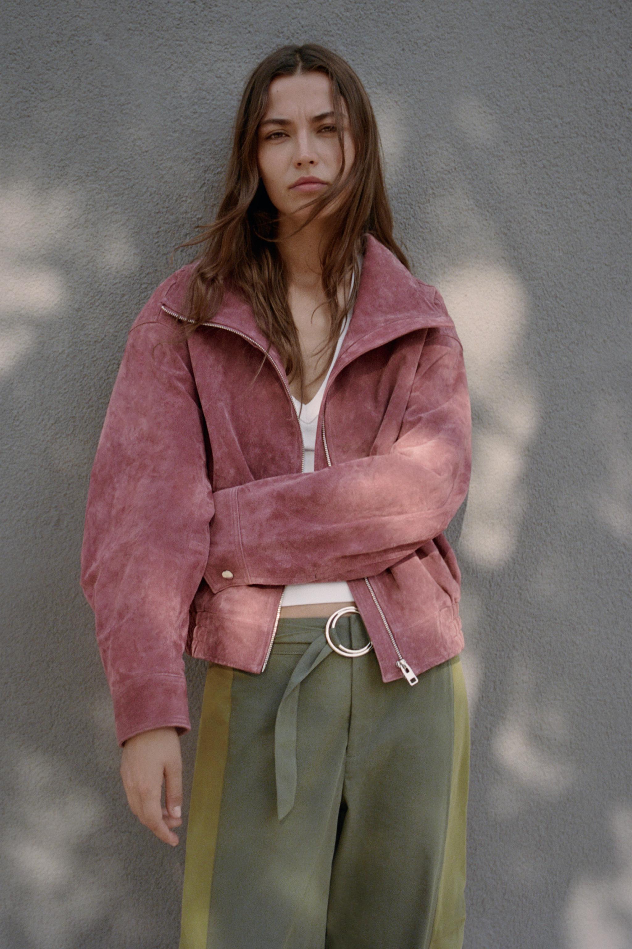 Featuring  a sleek zip-up front, and a relaxed cropped silhouette, this statement piece is the ultimate choice for chic urban getaways.