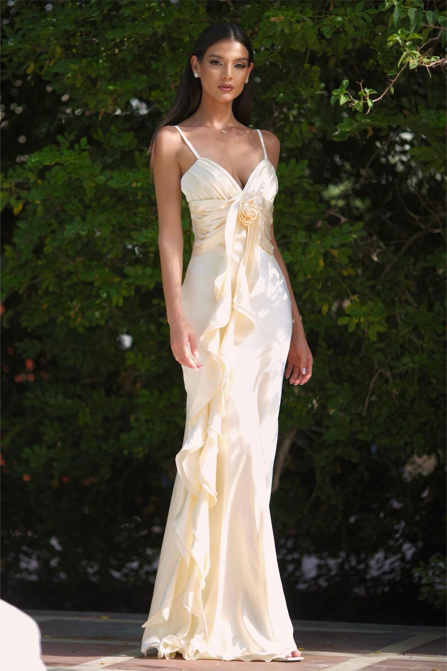 Featuring a delicate spaghetti straps, a handcrafted 3D rose accent at the bodice,this gown is the ultimate statement piece for luxury resort getaways.