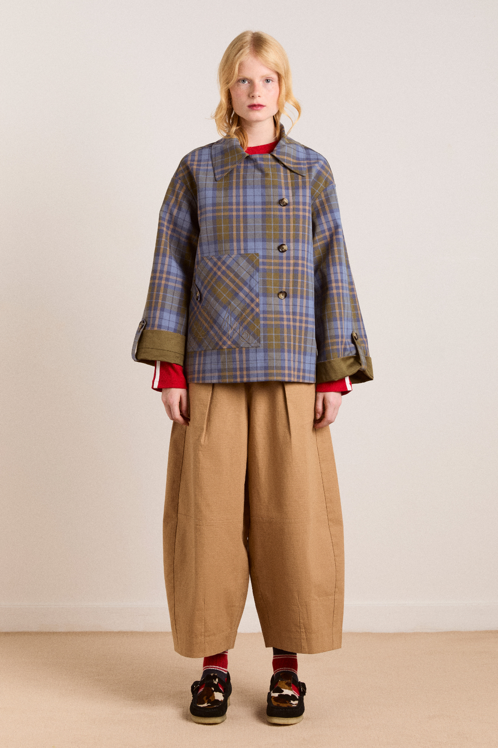 Featuring with classic neutral plaid check on one side and a clean solid cream tone,this jacket is the ultimate statement piece for chic urban getaways.
