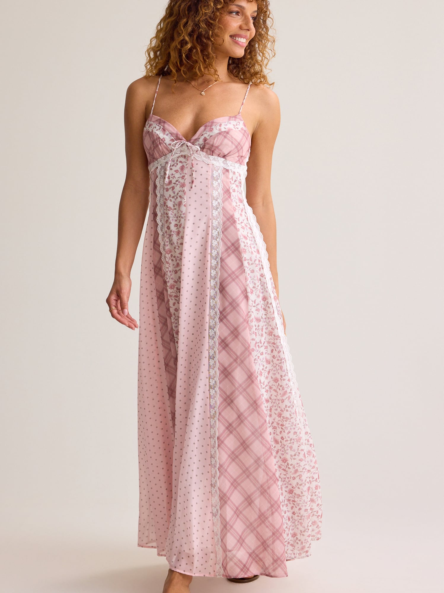 Featuring a sweetheart neckline with a dainty front tie, this maxi dress is the ultimate statement piece for luxury resort getaways and summer soirées.