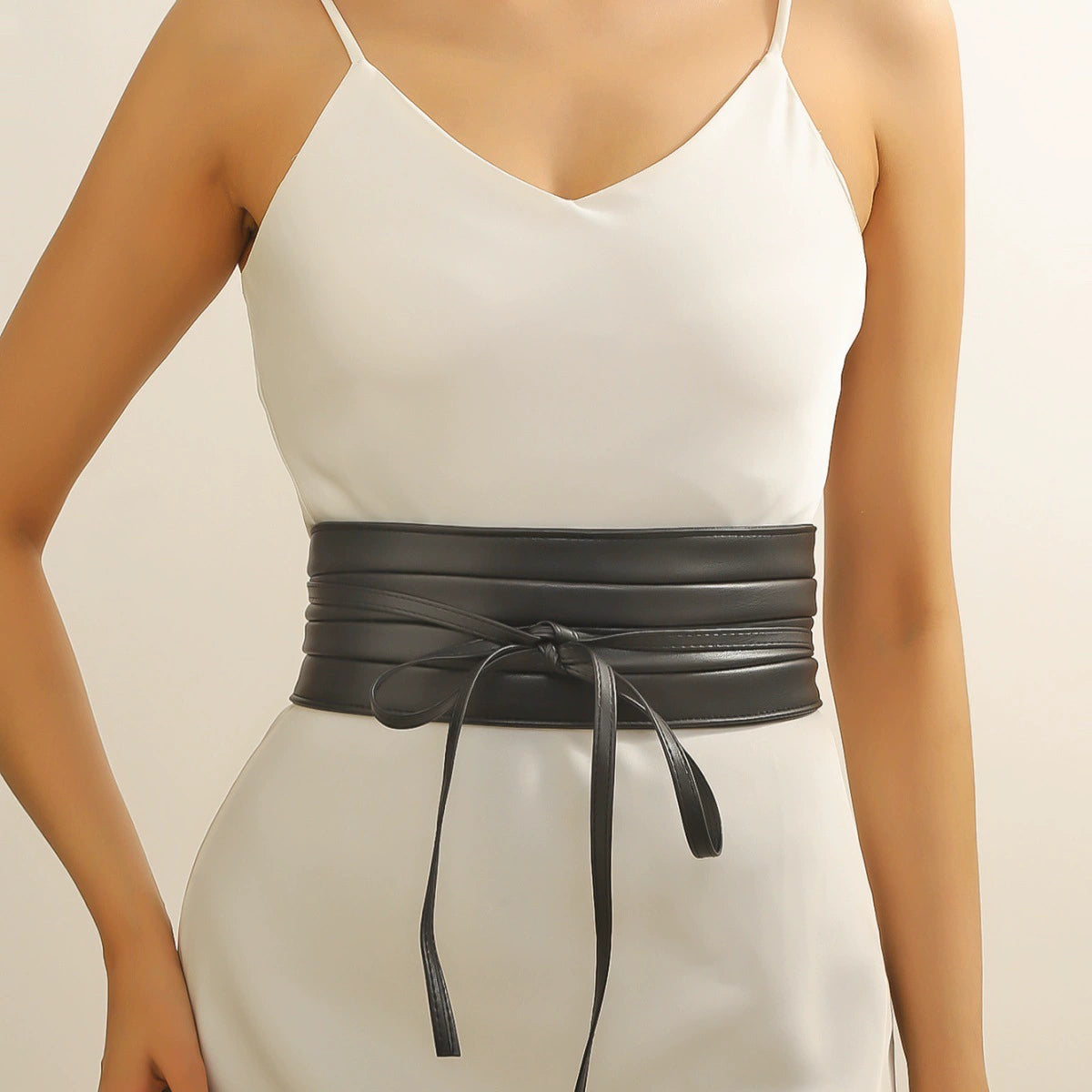 Featuring a wide multi-wrap design, and a delicate front tie closure, this versatile accessory is the ultimate statement piece to elevate dresses.