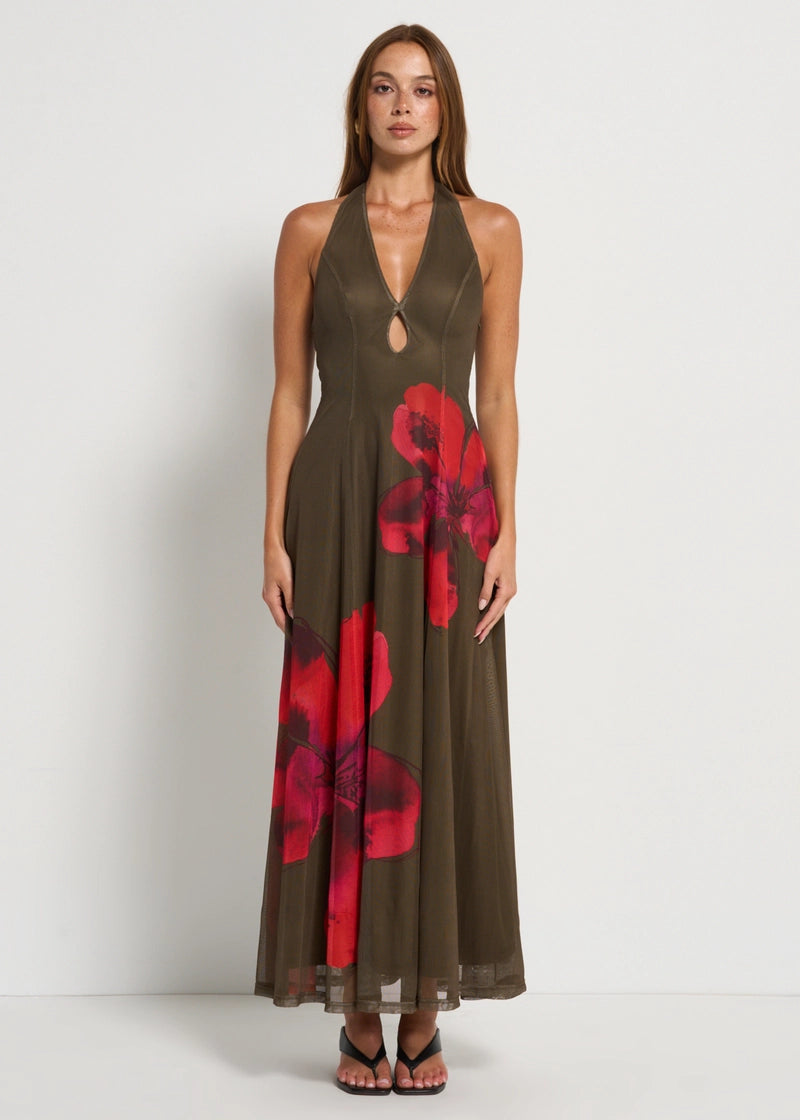 Featuring a  striking oversized red floral prints, a flattering halter neckline, this dress is the ultimate statement piece for luxury resort getaways.