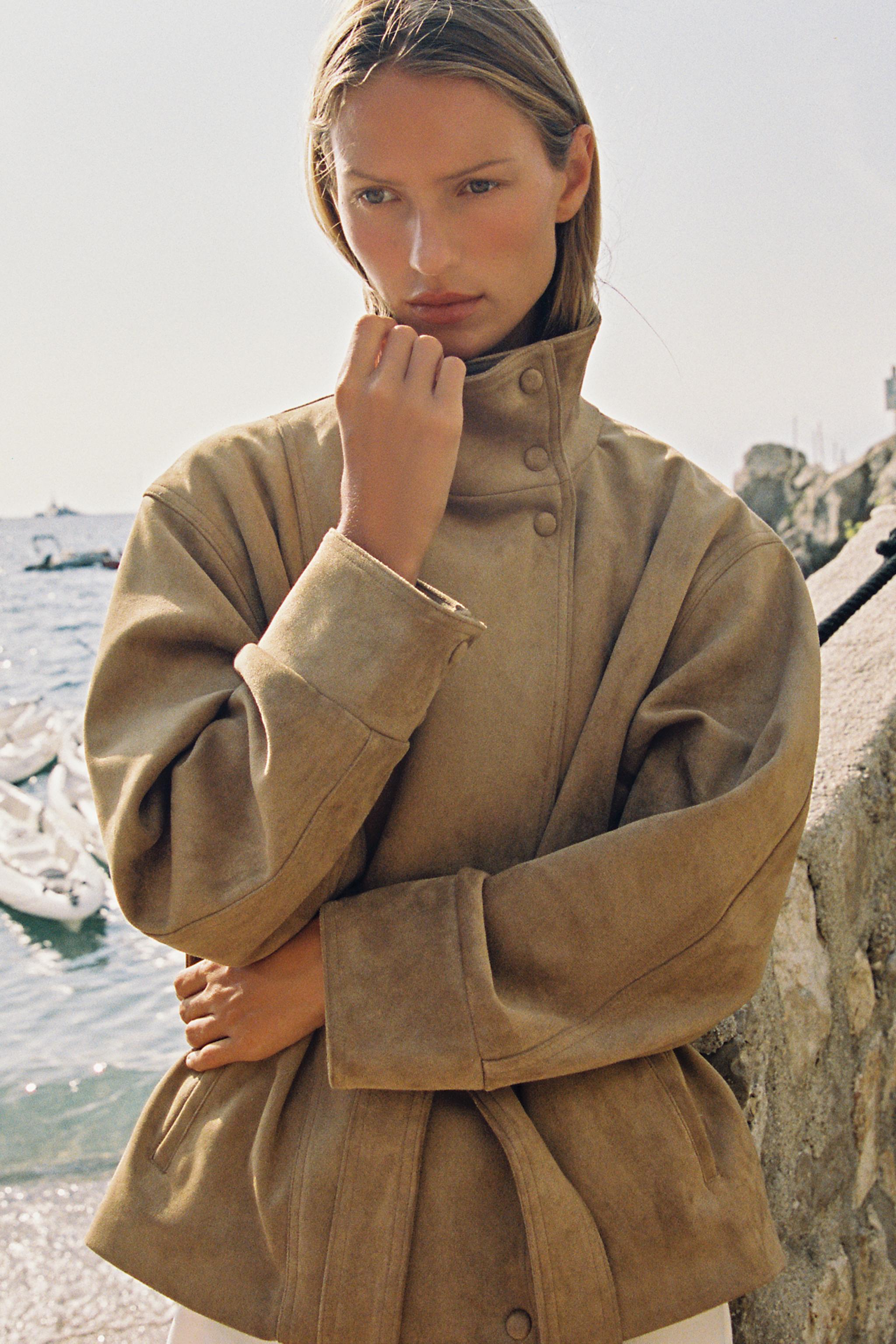 Featuring a structural snap-button collar, a matching self-tie waist belt, this jacket is the ultimate statement piece for cool coastal getaways.