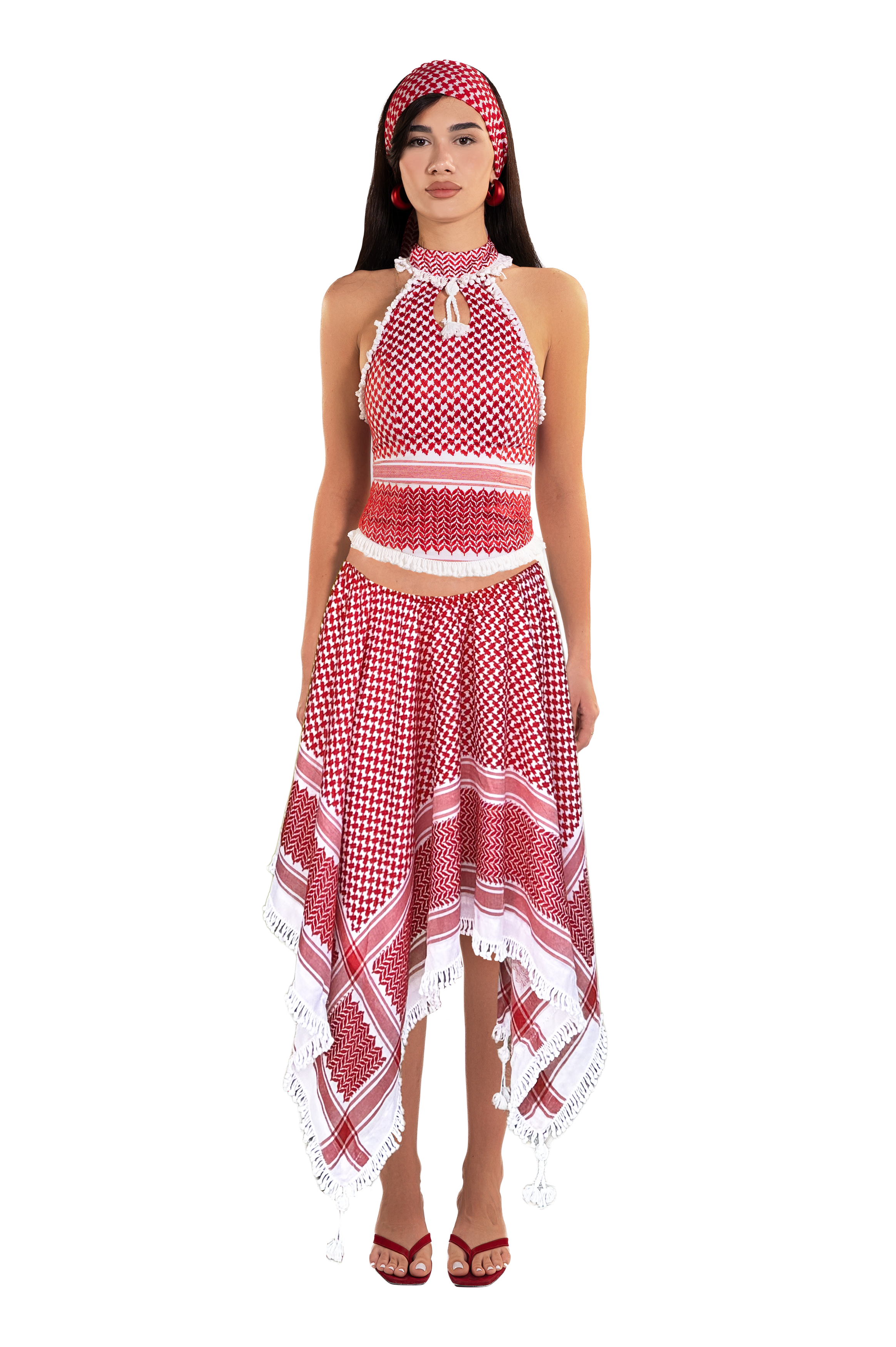 Featuring a vibrant red and white traditional, an asymmetrical handkerchief hemline, this skirt is the ultimate statement piece for luxury resort getaways.