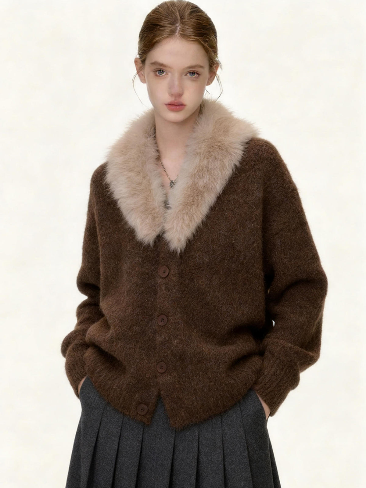 Featuring a cream faux fur shawl collar, a front button-up placket, this cardigan is the ultimate statement piece for cool resort getaways.