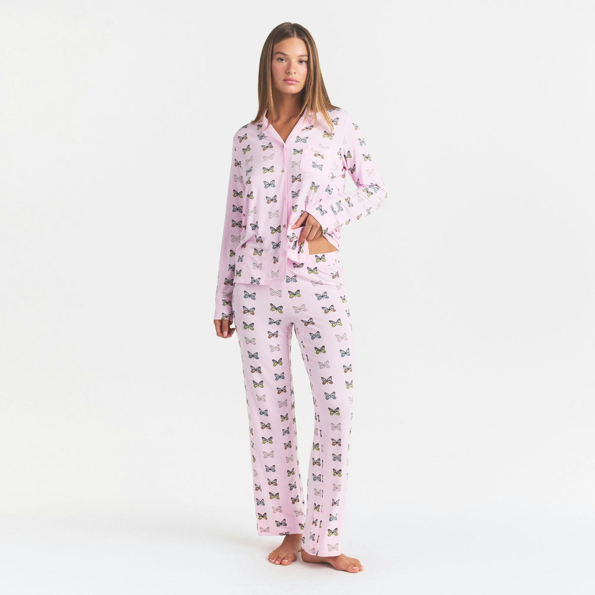 Featuring all-over colorful butterfly print, a classic notch-collar top,and matching pants, this set is the ultimate statement piece for luxury resort lounging.
