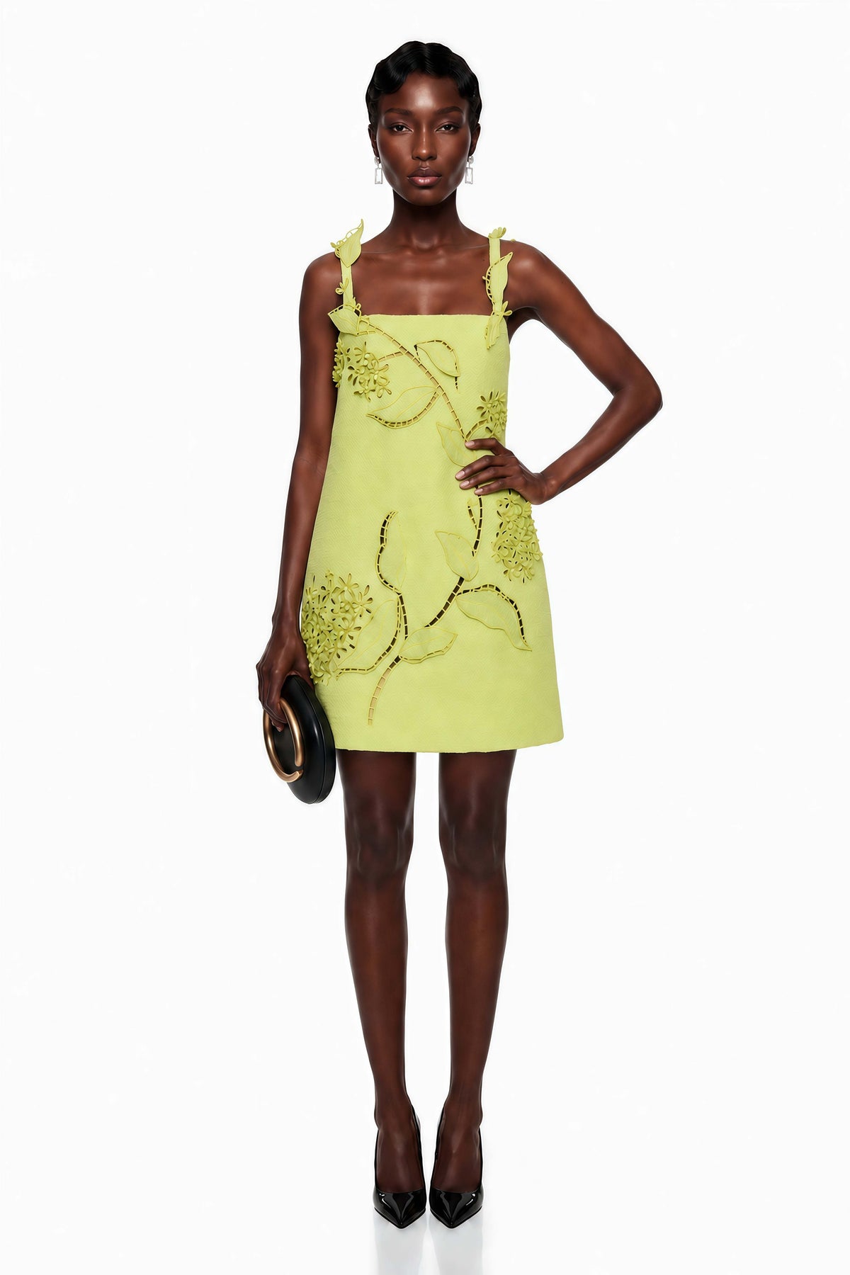Featuring a floral vine appliqués, a clean square neckline, shoulder strap details,this dress is the ultimate statement piece for luxury resort getaways.