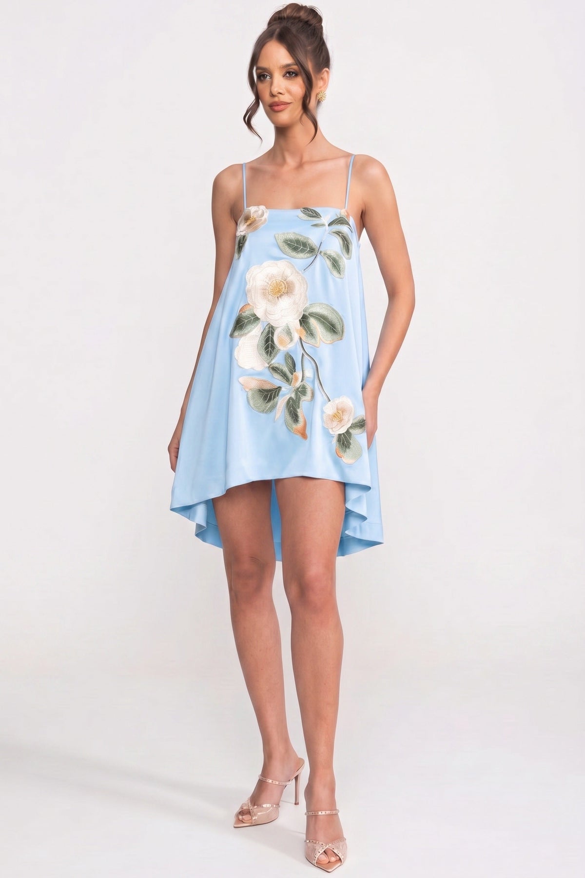 Featuring a intricate embroidered and floral vine appliqués, a clean square neckline,this dress is the ultimate statement piece for luxury resort getaways.
