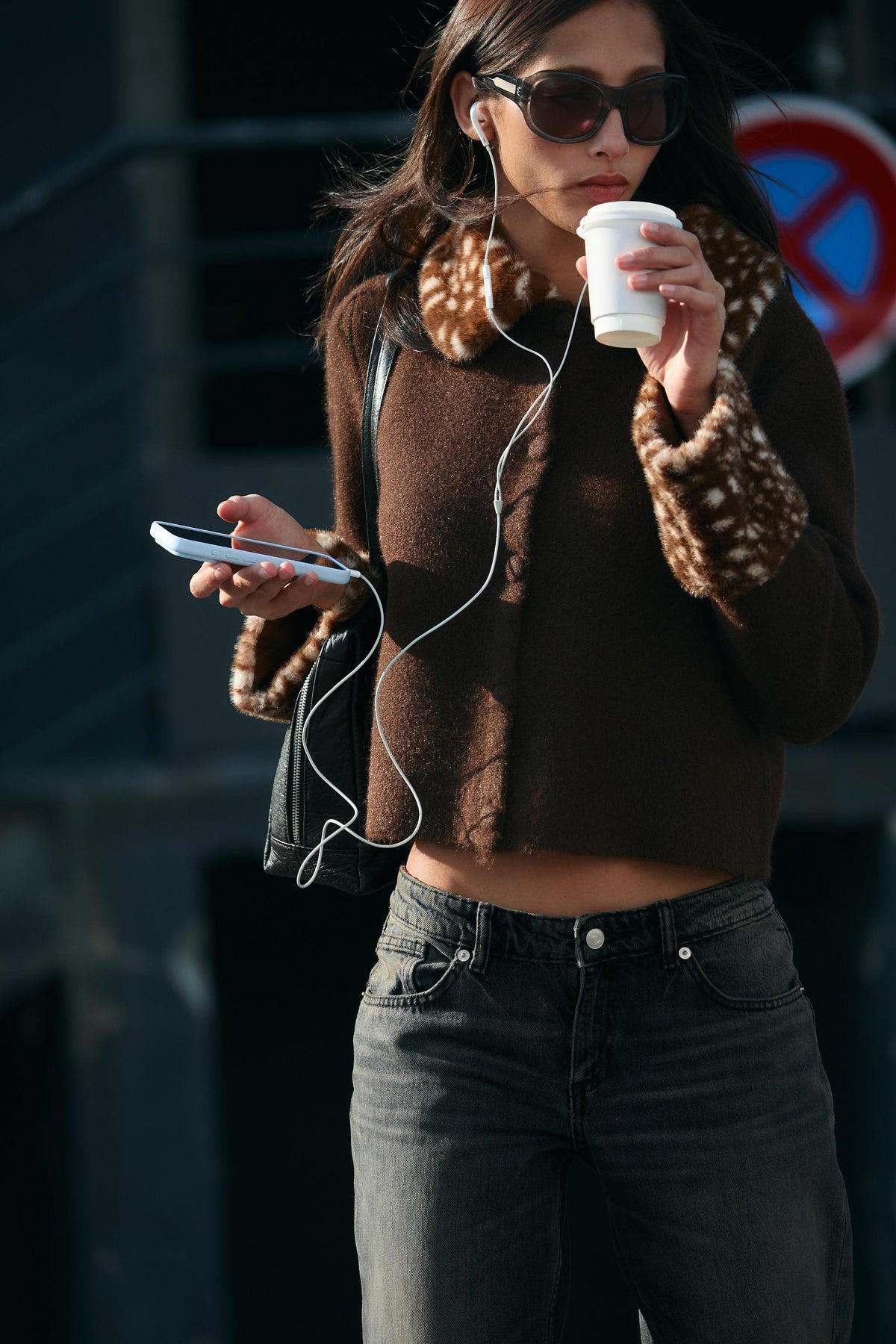 Featuring a plush faux-fur fawn-spotted collar and cuffs, a classic button-front closure,this jacket is the ultimate statement piece for luxury resort getaways.