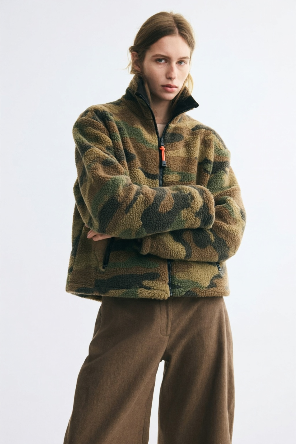 Featuring a high mock collar with full-zip closure, and practical zipped pockets, this jacket is the ultimate statement piece for luxury resort getaways.