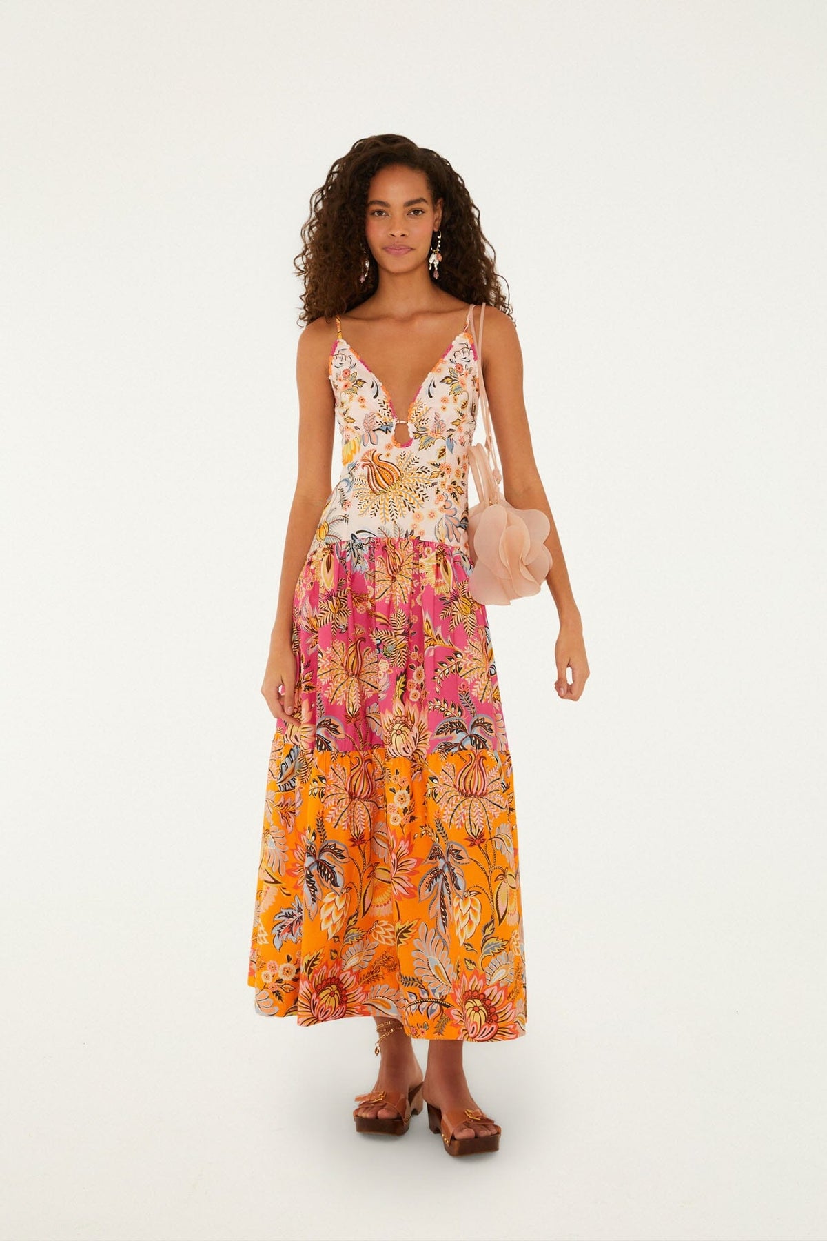 Featuring a botanical and floral prints, a delicate V-neckline, this dress is the ultimate statement piece for luxury resort getaways.