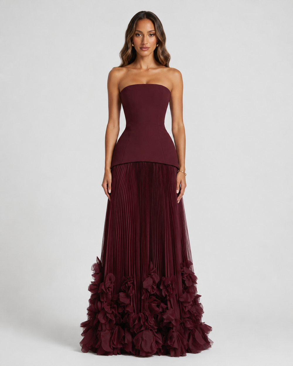 Featuring a flattering peplum waist, and a dramatic 3D petal-trimmed hem, this dress is the ultimate statement piece for luxury resort getaways.