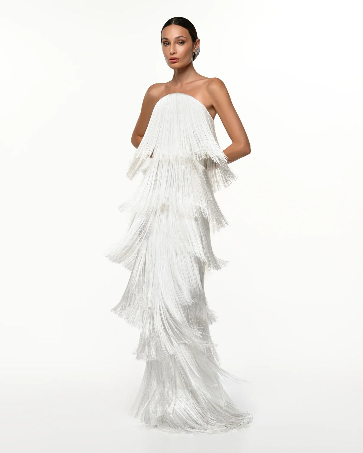 Featuring a multi-tiered fringe layers that create incredible movement, this dress is the ultimate statement piece for luxury resort getaways.