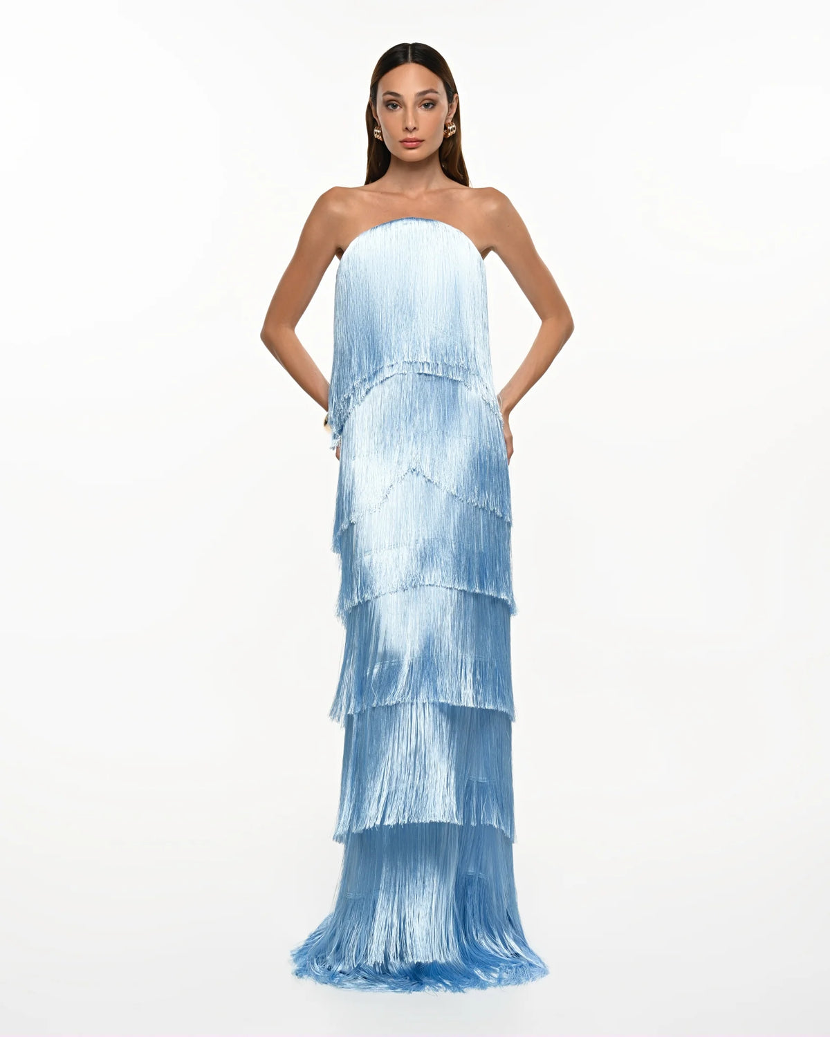 Featuring a multi-tiered fringe layers that create incredible movement, this dress is the ultimate statement piece for luxury resort getaways.