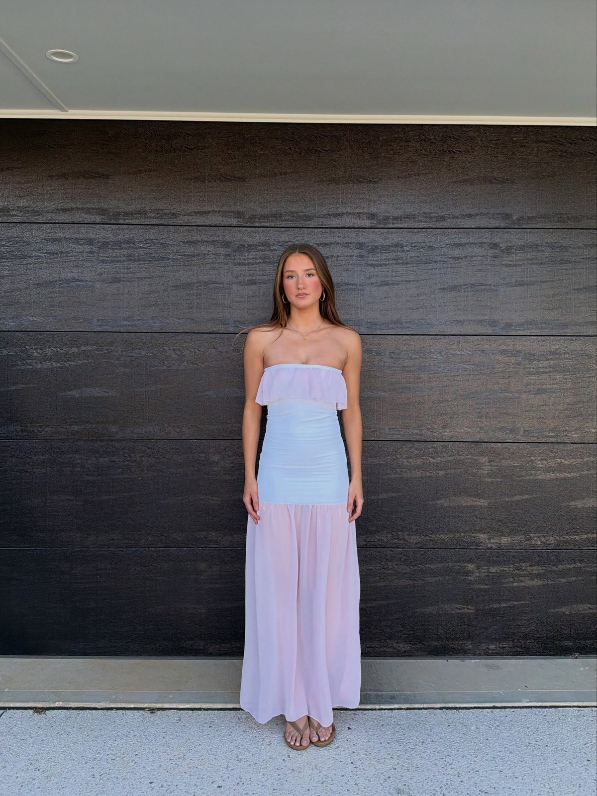 Add soft romance to your wardrobe with the Seashellly Ruffled Strapless Chiffon Set. Featuring blush chiffon, ruffle bust and ruched bodice. 